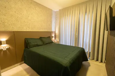 Uma cama ou camas num quarto em Solar do Atlântico 108 – Beira Mar em Bombas