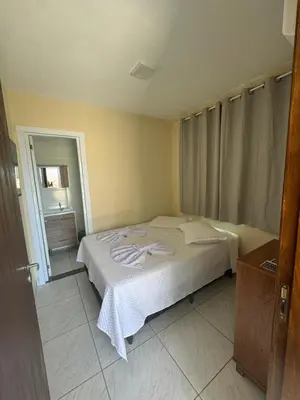 Uma cama ou camas num quarto em Residencial Lara 10
