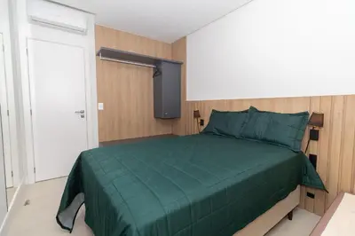 Uma cama ou camas num quarto em Adra 202 - Apartamento com 3 quartos - Centro de Bombinhas