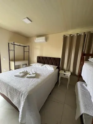 Uma cama ou camas num quarto em Residencial Lara 8