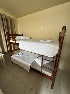 Uma cama ou camas num quarto em Residencial Lara 8