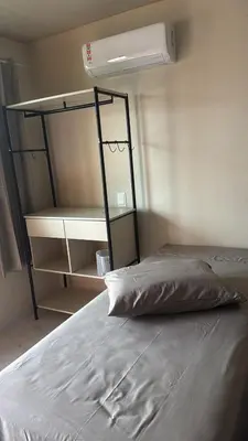 Uma cama ou camas num quarto em Residencial Lara 8