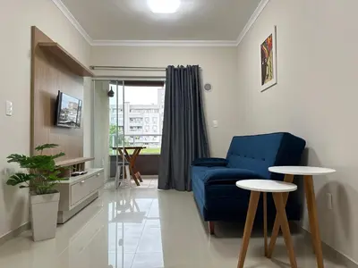 Uma área de estar em Apartamento 2 quartos em Bombinhas