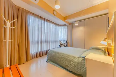 Uma cama ou camas num quarto em Loft Aconchegante em Condomínio com Piscina