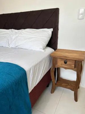 Uma cama ou camas num quarto em Apto palmas- 3 quartos com churrasqueira