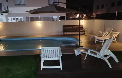 A piscina em ou perto de minhacasapraiapalmas istag 4 suítes 30 hosp a combinar