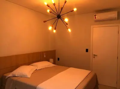 Uma cama ou camas num quarto em Apartamento para sua estadia em Porto Belo -SC