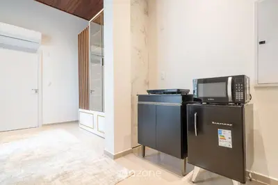 A cozinha ou kitchenette de Aptos em prédio à 650 m da Meia Praia - RGOs