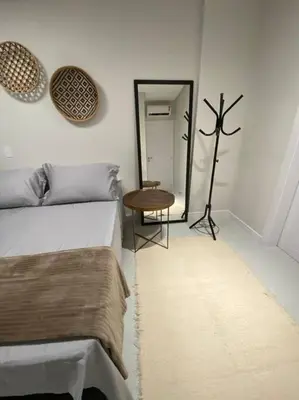 Uma cama ou camas num quarto em Apto Novo Bombinhas - UMA QUADRA DO MAR!