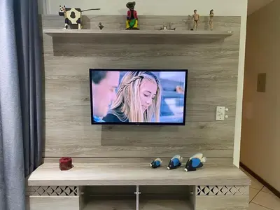 Uma televisão e/ou sistema de entretenimento em B106 - Apartamento de 2 quartos com vista mar