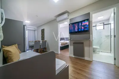 Uma televisão e/ou sistema de entretenimento em 508- Apart com vista ao mar com piscina em Bombas