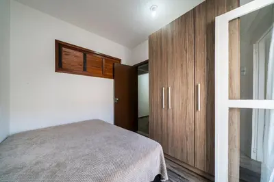 Uma cama ou camas num quarto em Apartamento 3 dormitórios - 50 metros da Praia de Bombinhas