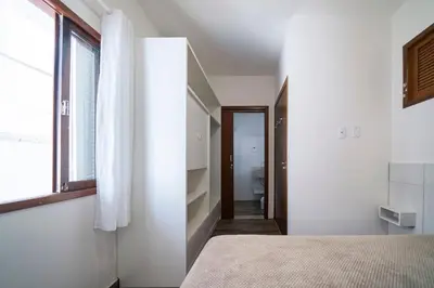 Uma cama ou camas num quarto em Apartamento 3 dormitórios - 50 metros da Praia de Bombinhas