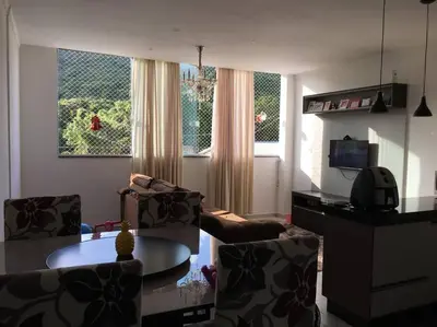 Uma área de estar em Apartamento confortável na praia de Bombas