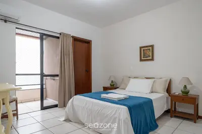 Uma cama ou camas num quarto em Apto 3Q à beira-mar c/ churrasqueira RSL0502