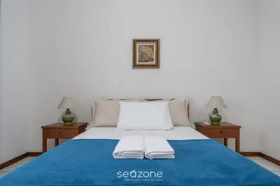 Uma cama ou camas num quarto em Apto 3Q à beira-mar c/ churrasqueira RSL0502