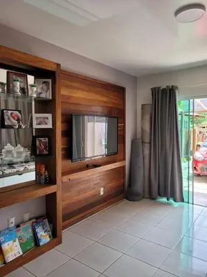 Uma televisão e/ou sistema de entretenimento em Casa praia de Zimbros