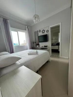 Uma cama ou camas num quarto em Apartamento com 3 suítes a 300 metros da praia
