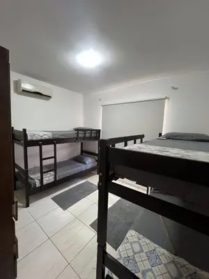Uma cama ou camas num quarto em Pousada Sabores do Mar Laranjeiras