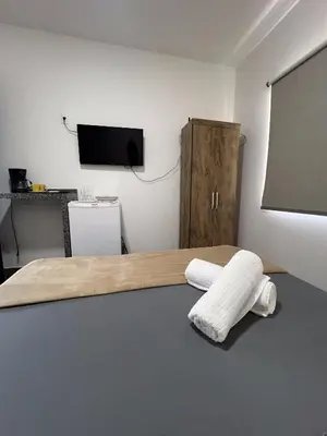 Uma cama ou camas num quarto em Pousada Sabores do Mar Laranjeiras