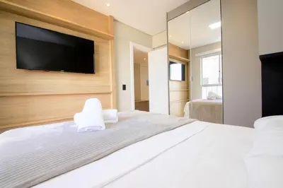 Uma cama ou camas num quarto em Apto Vista Mar na Av. Atlântica, Barra Sul NF1414
