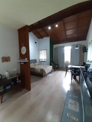 Uma cama ou camas num quarto em Stúdio Natureza S/A 1
