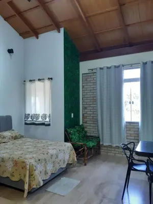 Uma cama ou camas num quarto em Stúdio Natureza S/A 1