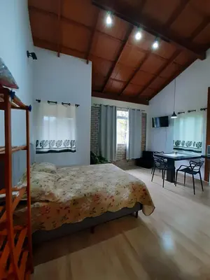 Uma cama ou camas num quarto em Stúdio Natureza S/A 1