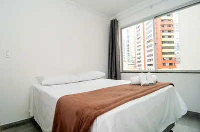 Uma cama ou camas num quarto em Aconchego 150 metros da Praia na Rua 3604 SW3421