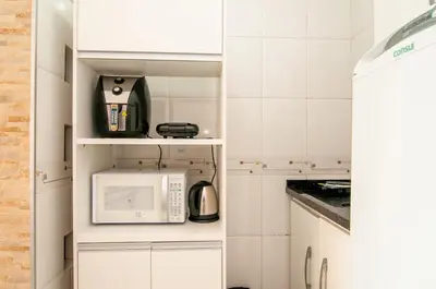 A cozinha ou kitchenette de Aconchego 150 metros da Praia na Rua 3604 SW3421