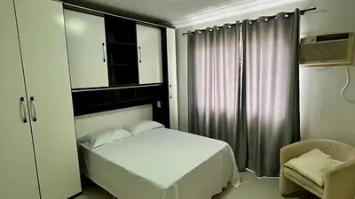 Uma cama ou camas num quarto em Apto Almeida e Moraes Frente Mar Balneário Camboriú