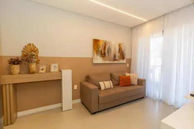 Uma área de estar em 010A - Lindo apartamento 2 dormitórios na praia de Bombas