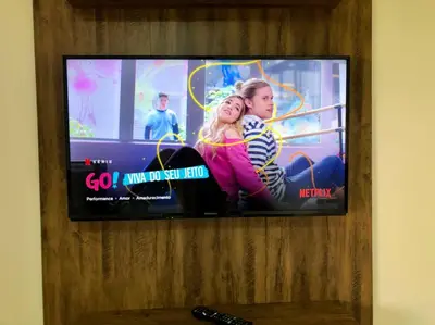Uma televisão e/ou sistema de entretenimento em Apartamento novo aconchegante em Palmas / WiFi