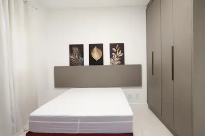Uma cama ou camas num quarto em 3 suítes + vista mar - Le Premier