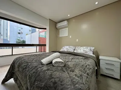 Uma cama ou camas num quarto em DA01- 3 Quartos | Vista Mar | Churrasq e Garagem