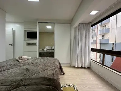 Uma televisão e/ou sistema de entretenimento em DA01- 3 Quartos | Vista Mar | Churrasq e Garagem
