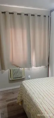 Uma cama ou camas num quarto em Apartamento meia praia
