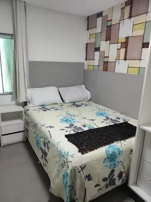 Uma cama ou camas num quarto em Promoção quatro quartos Avenida Atlântica