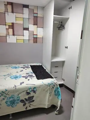 Uma cama ou camas num quarto em Promoção quatro quartos Avenida Atlântica