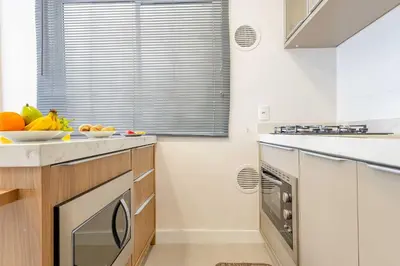 A cozinha ou kitchenette de Loft Aconchegante a Poucos Minutos da Praia de Bombinhas