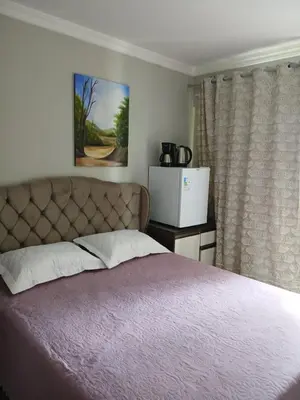 Uma cama ou camas num quarto em Suíte Aconchegante Balneário Camboriú próximo Praia
