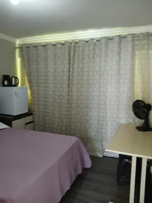 Uma cama ou camas num quarto em Suíte Aconchegante Balneário Camboriú próximo Praia