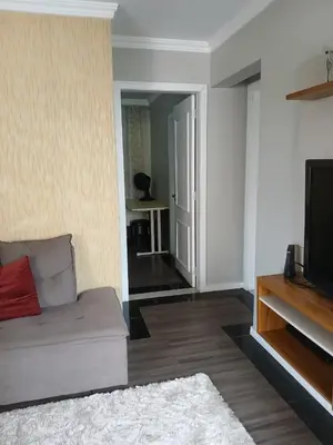 Uma televisão e/ou sistema de entretenimento em Suíte Aconchegante Balneário Camboriú próximo Praia