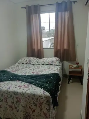 Uma cama ou camas num quarto em Linda Casa no Sossego da Praia