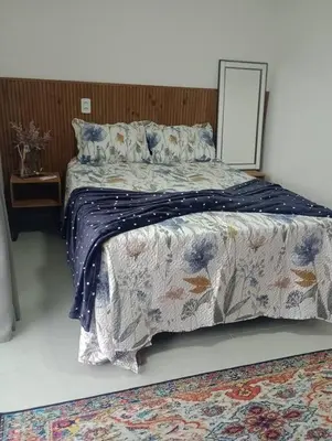 Uma cama ou camas num quarto em Linda Casa no Sossego da Praia