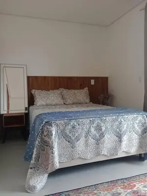 Uma cama ou camas num quarto em Linda Casa 2 no Sossego da Praia
