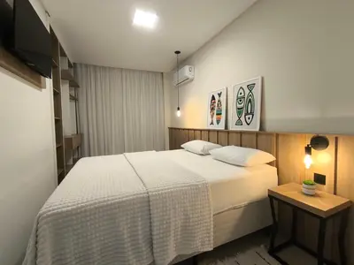 Uma cama ou camas num quarto em Refúgio Praiano em Bombinhas - Aluguel Temporada