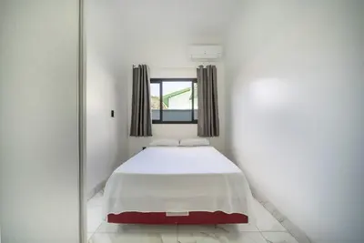 Uma cama ou camas num quarto em Casa em Bombinhas