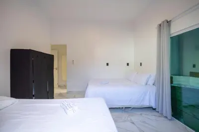Uma cama ou camas num quarto em Casa em Bombinhas