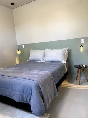 Uma cama ou camas num quarto em Loft 116 B - Porto Belo/SC